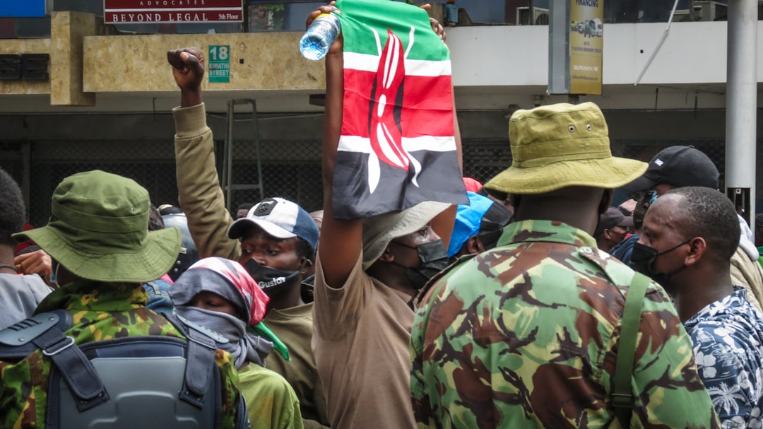 Kenyan citizens holding the national flag during a public demonstration